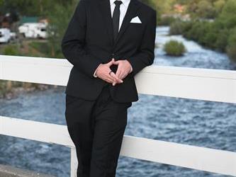 Student standing on the bridge for a photo.