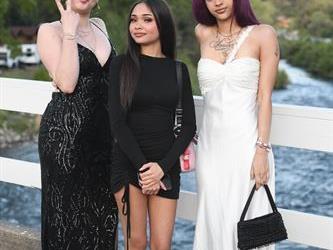 Three students standing on the bridge for a photo. 