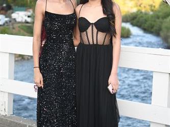 Two students posing on the bridge for a photo.